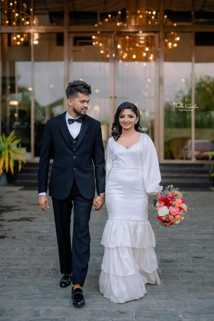 Bride and groom with a Ceylon Flora wedding bouquet