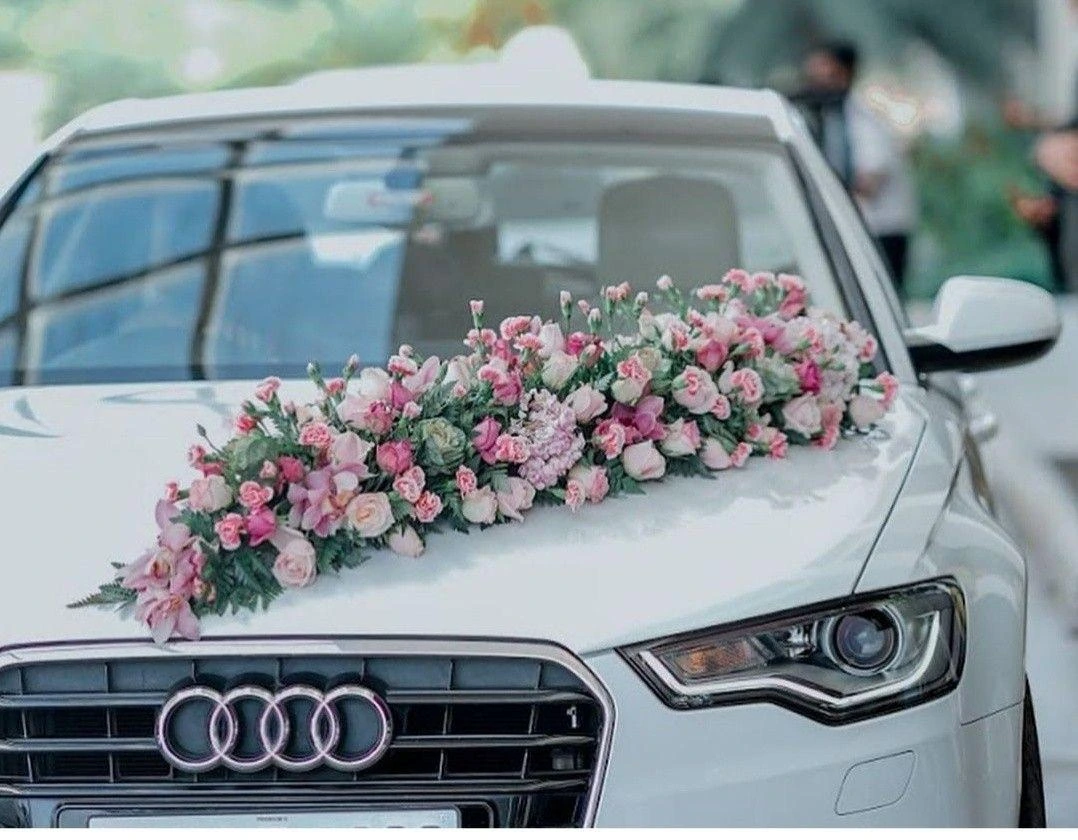 White wedding car floral decoration photographed outdoors
